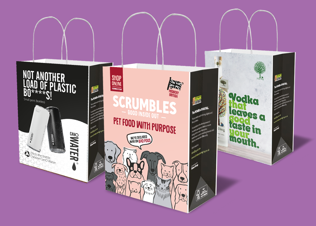 Bagboard-feature-image-2 3D visual of 3 Bagboard bags on a purple background featuring advertisements for CanOWater, Scrumbles Pet food and Sapling Vodka