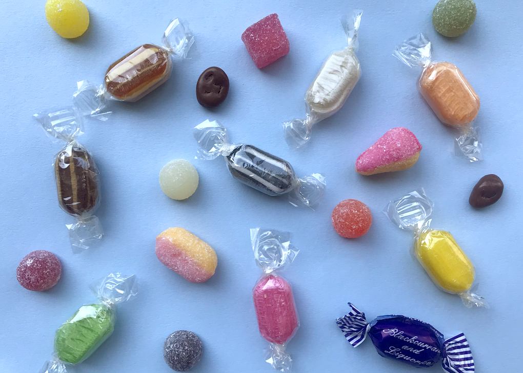 colourful sweets scattered on a blue background